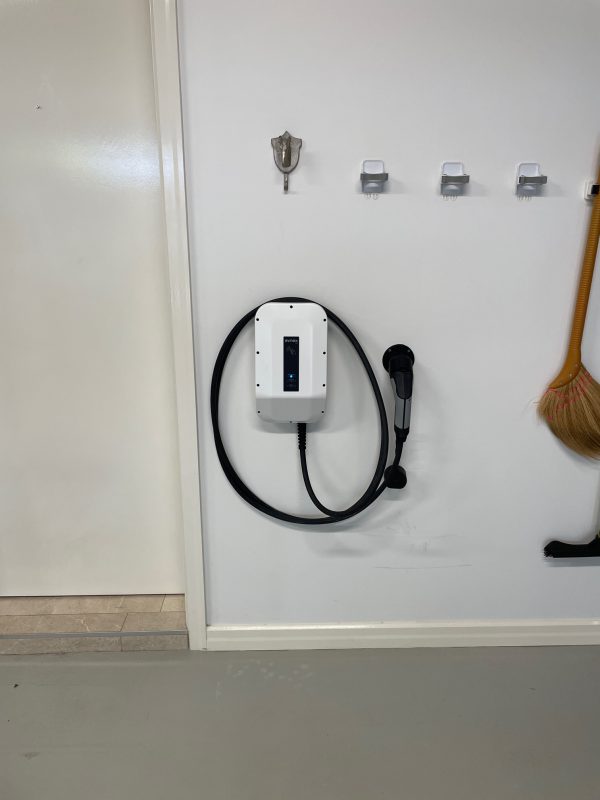 View of a newly installed renewable energy system with a view of the EV charger