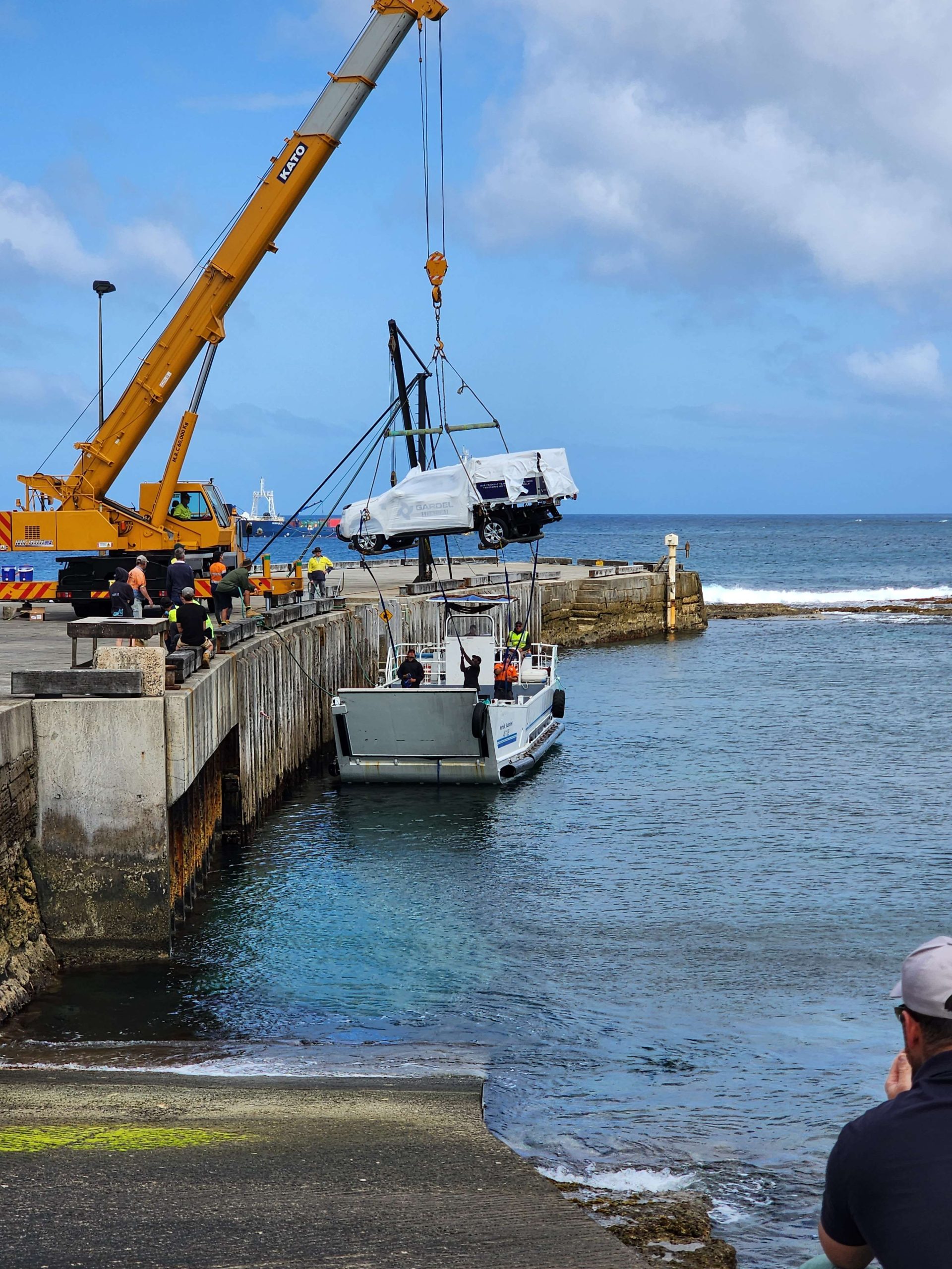 Image of Gardel Electrical & Solar vehicle being craned from the transport boat on Norfolk Island