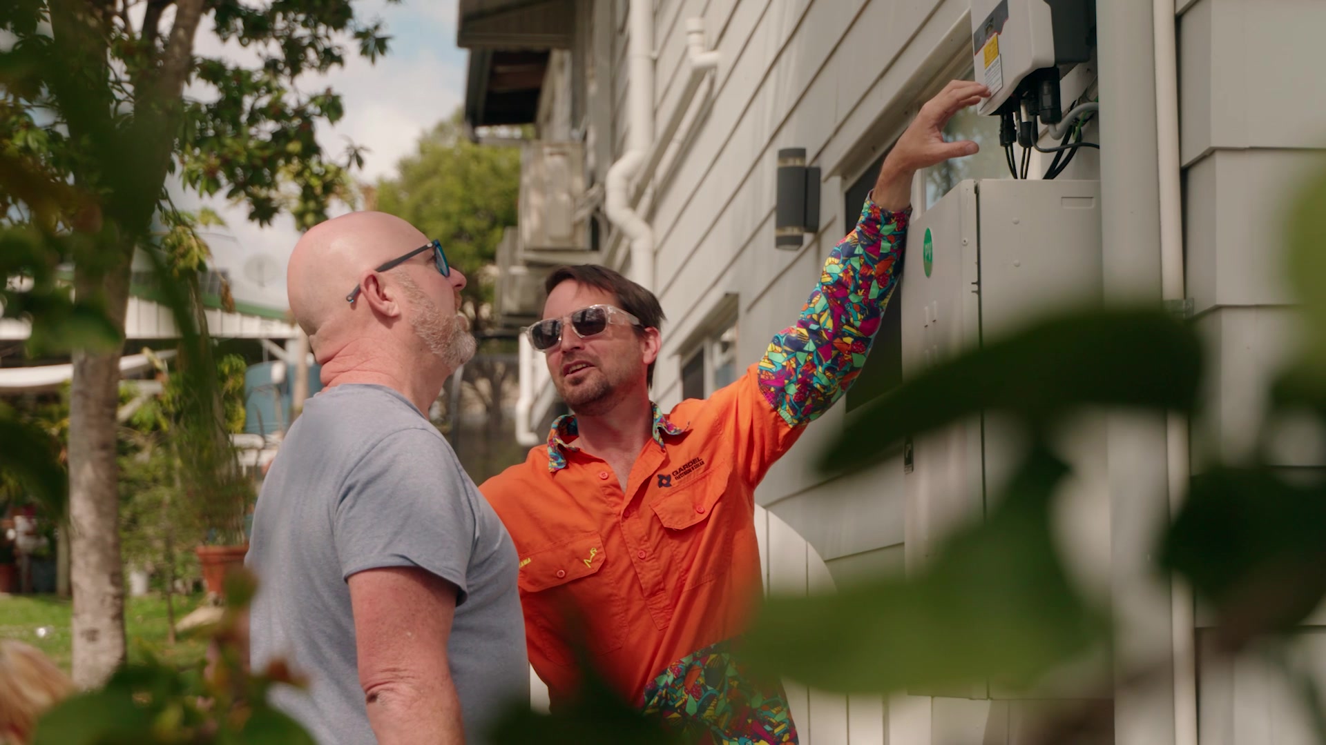 Lead hand Josh teaching homeowner about their system